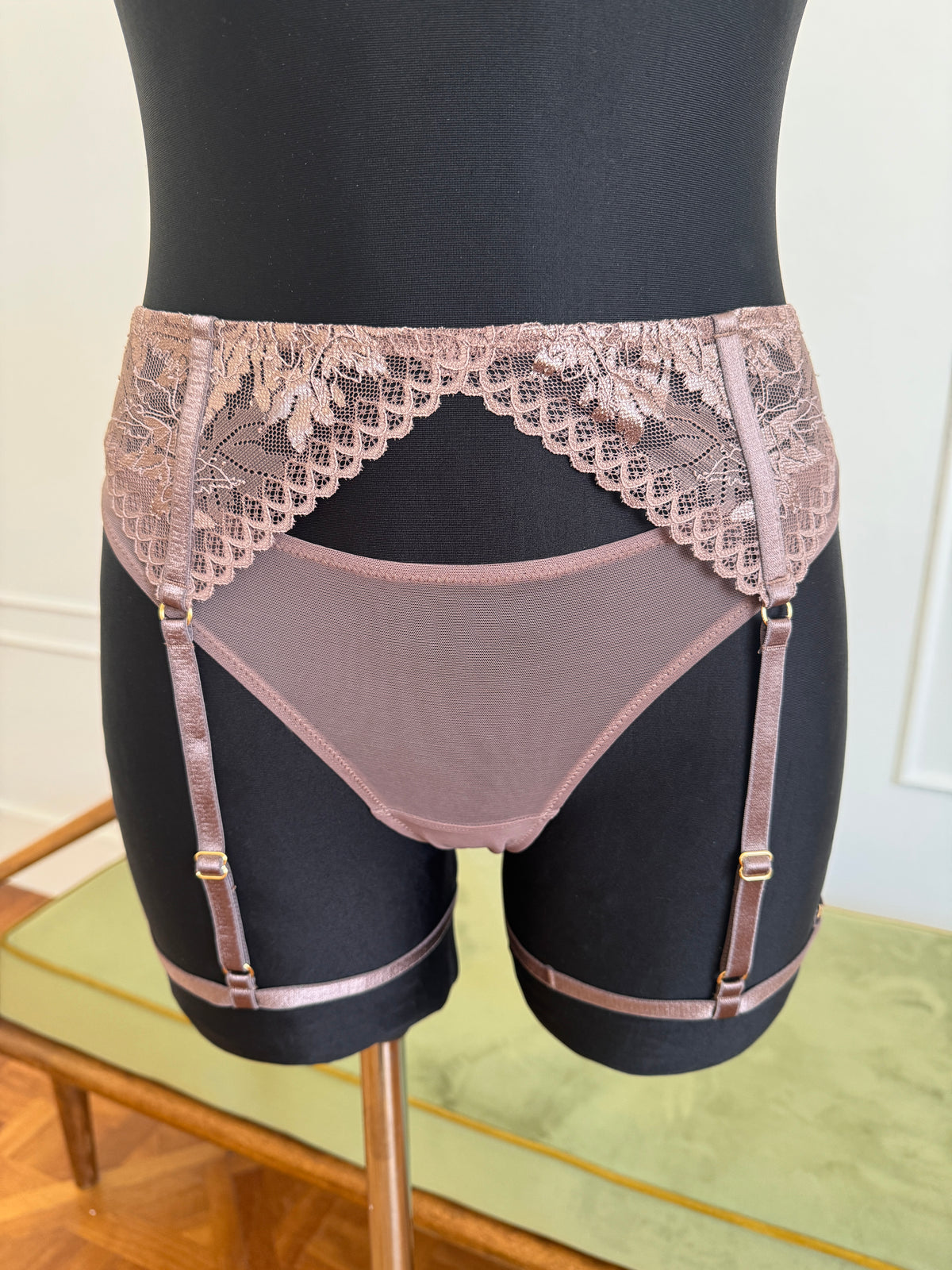 Juliette Suspender Belt in Mocha on a dress form, front view